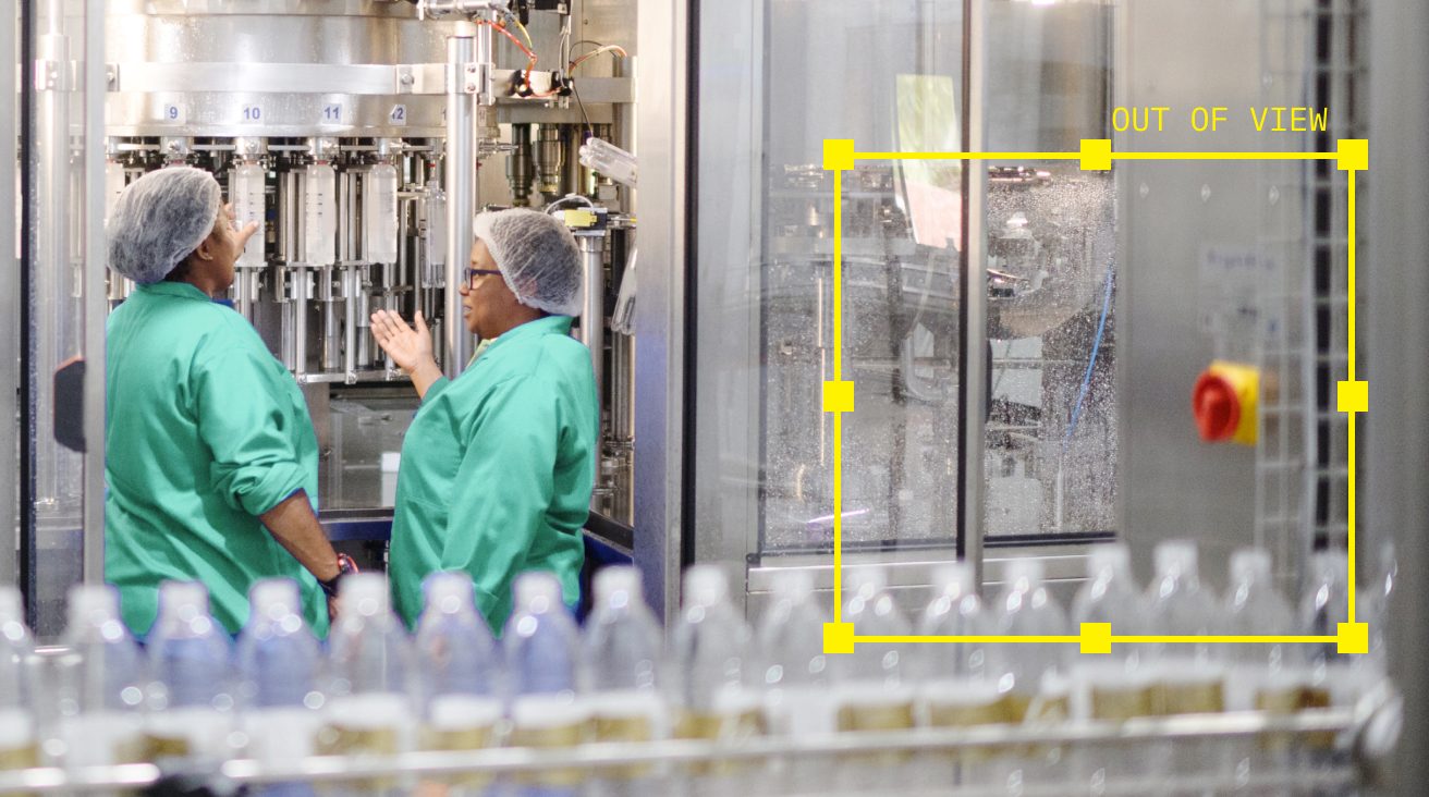 Operators reviewing a bottling line