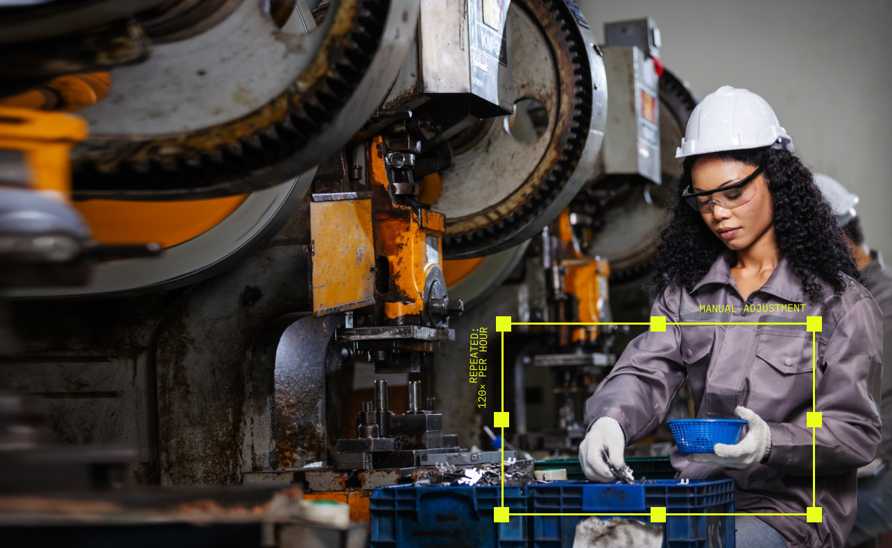 Operator sorting parts beside a press line